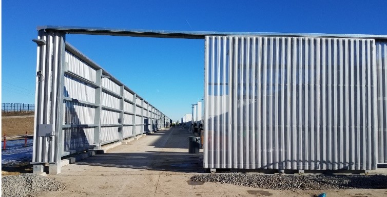 Industrial steel cantilever gate with long vertical louver pickets