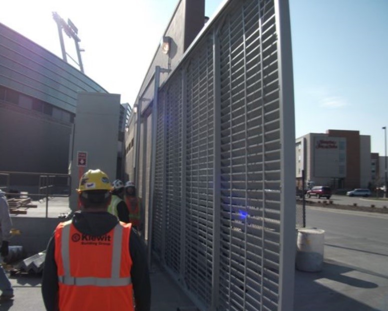 Horizontal louver cantilever gate installation at industrial facility