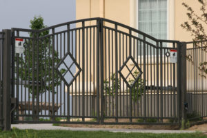 Custom automated commercial swing gate with diamond cutouts